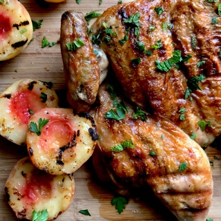 grilled chicken under a brick
